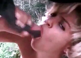 XXX action featuring a blonde passionately sucking horse's shaft