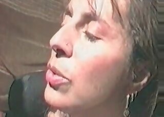 Erected shaft of a dog gets passionately sucked by a busty zoophile babe