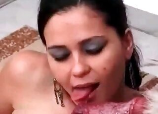 Naughty brunette passionately licks and sucks a dog's pecker